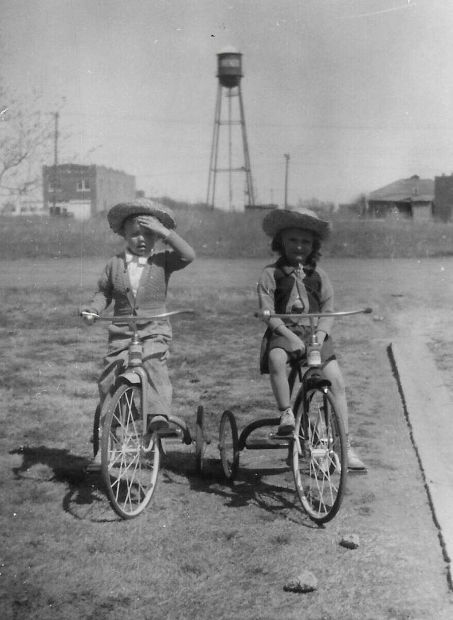 Boy and Girl on Tricycles in Sweetwater in 1930s