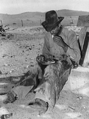 Cowboy eating dinner aftoer roundup