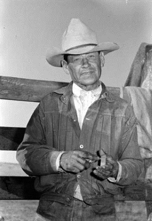 Cowboy Sharpens Knife 1939