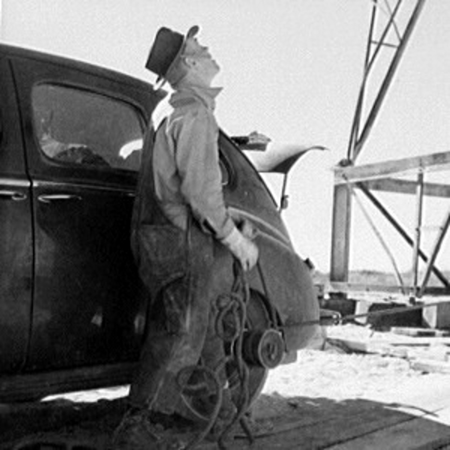 Derrick Builder Uses Car to Hoist Beam