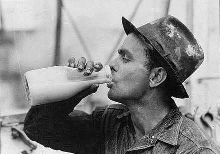 Oil field worker drinking milk