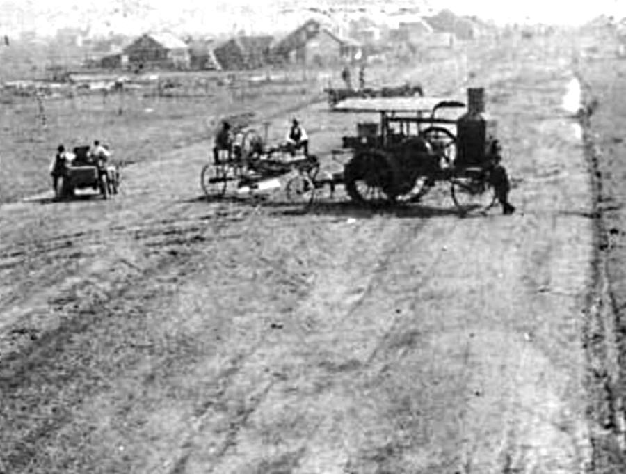 Early Tractor Pulls Road Grader in Gray County