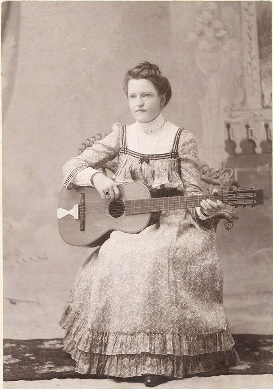 Young Woman Playing Guitar in 1890