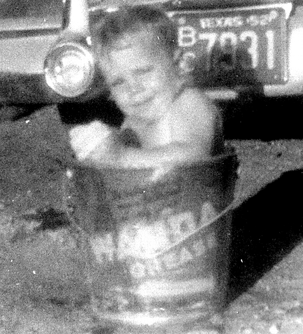 Boy Bathing In a Bucket